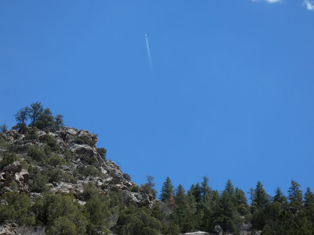 View of ridgeline at Strontia Springs with plane flying over