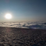 Morning sun above the clouds