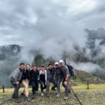 Group shot with views of Machu Picchu